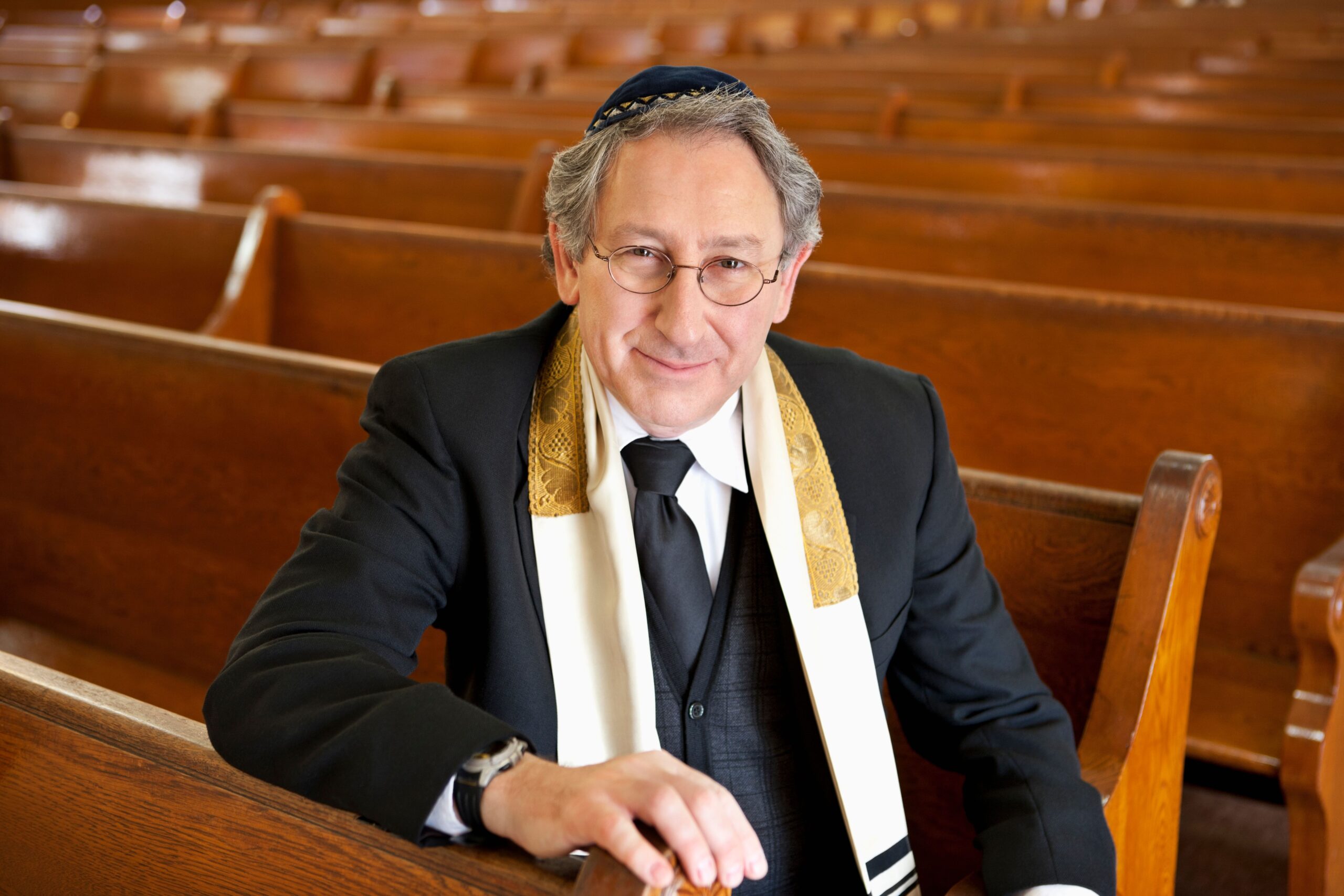 Rabbi sitting in a synagogue