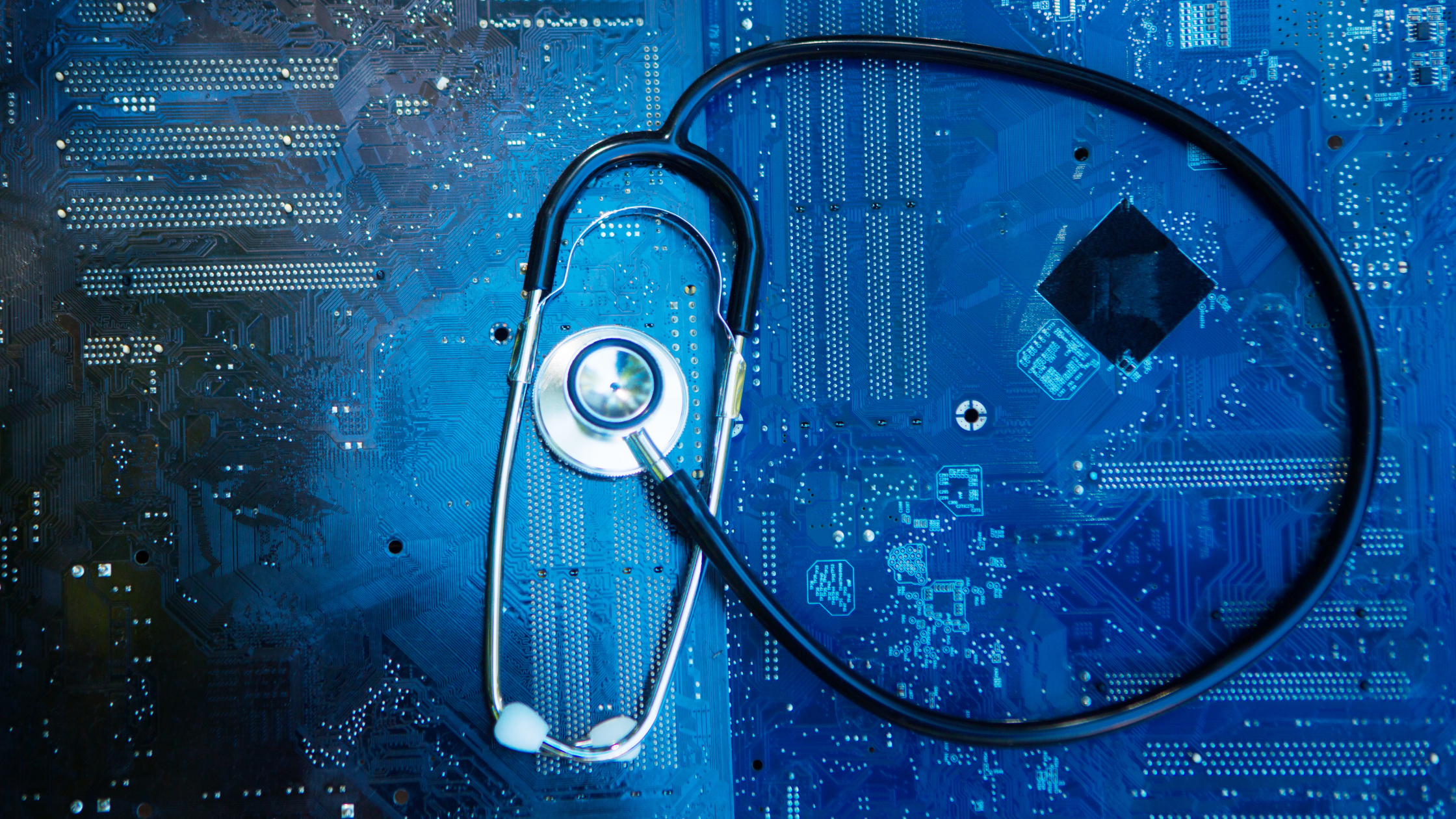 Stethoscope on a tech chip background indication of medicine and tech.
